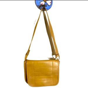 Light brown tan leather crossbody bag with flap